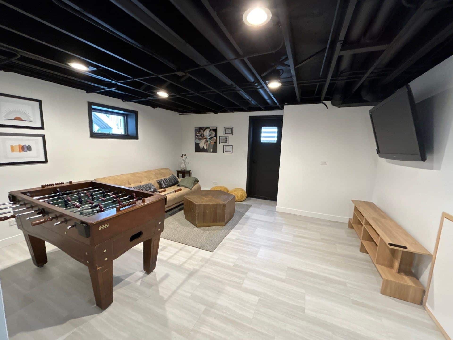 Finished basement recreation room completed by J&J Home Renovations
