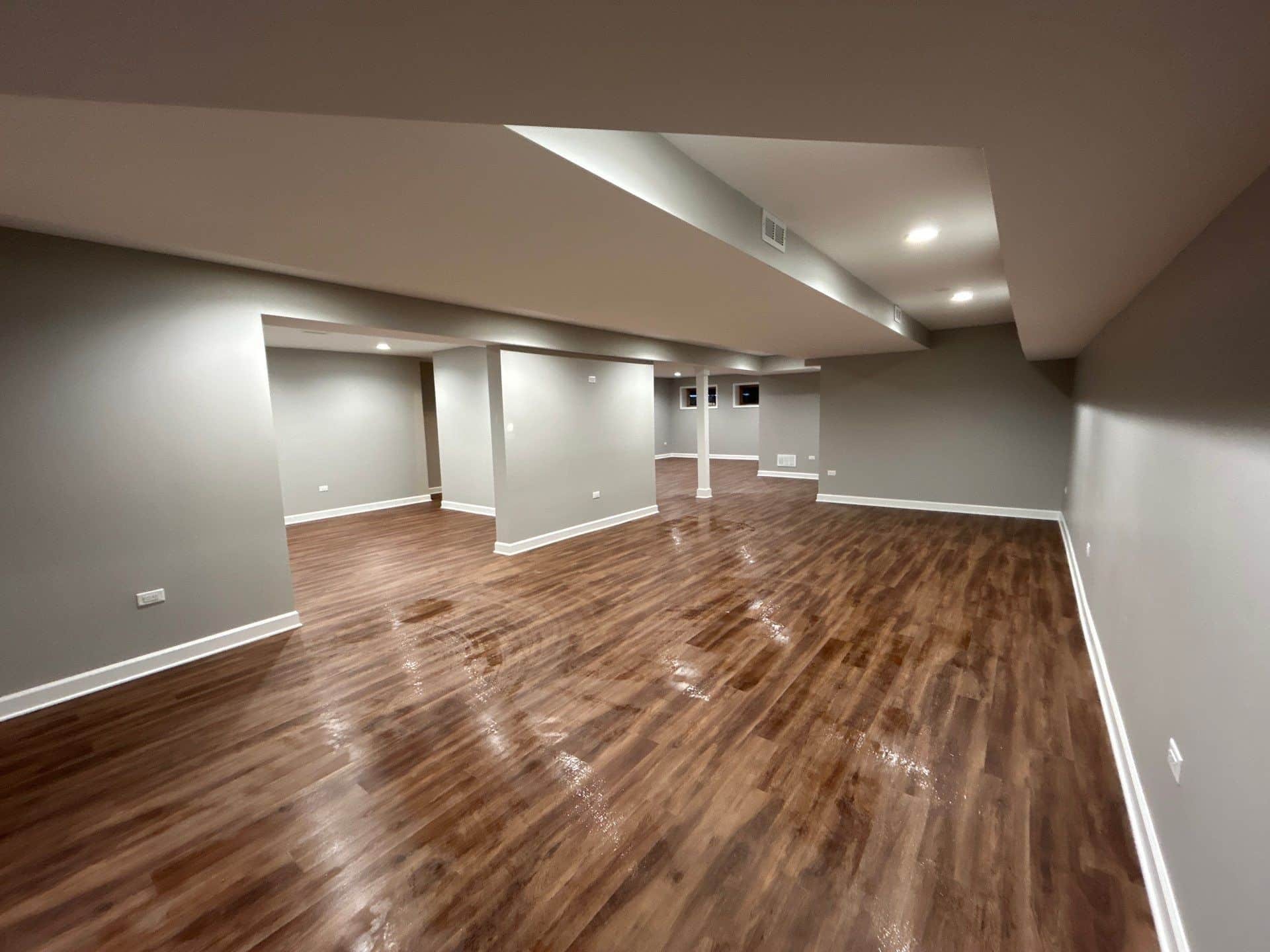 Finished basement with continuous plank flooring
