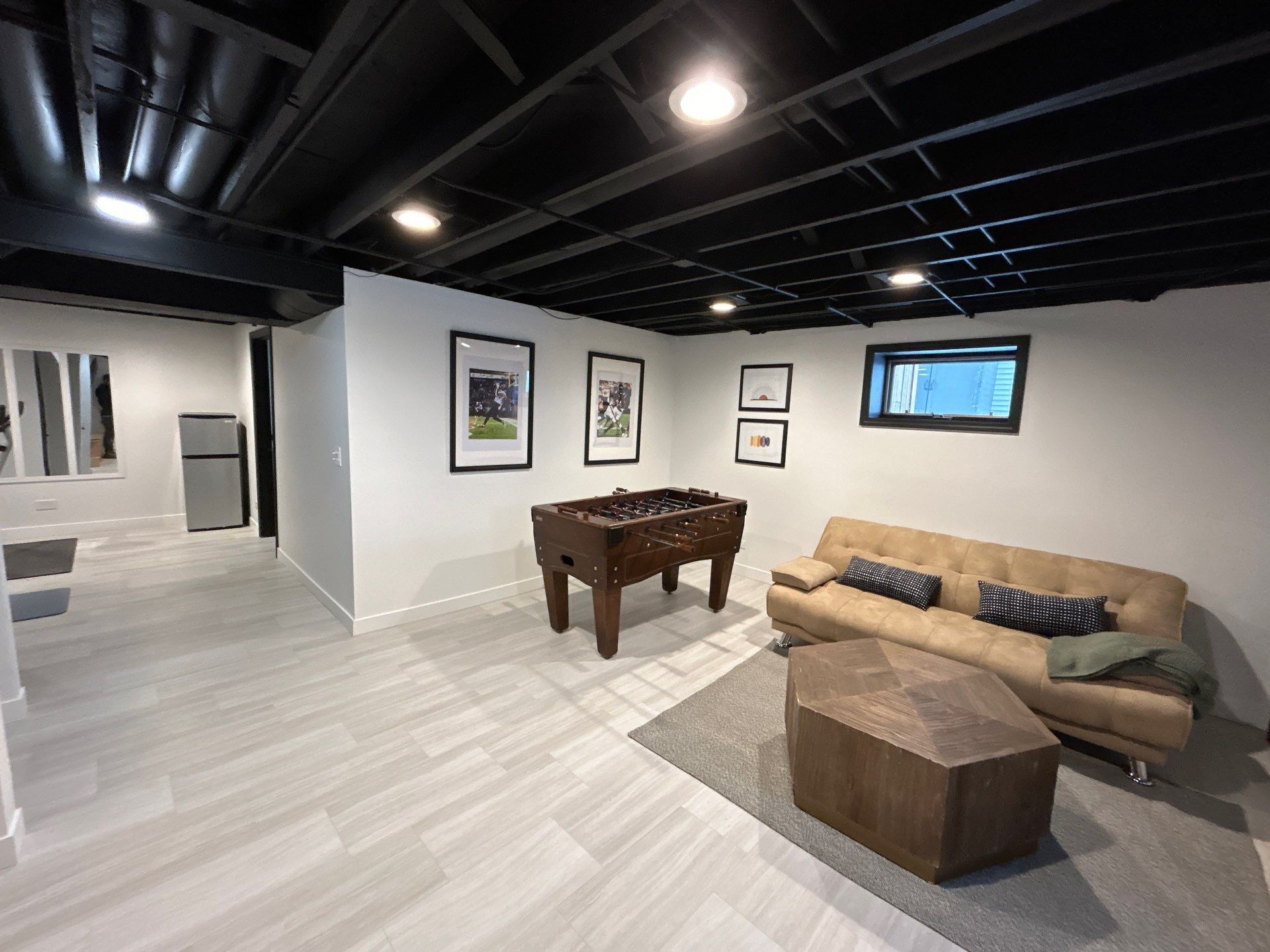 Open finished Mundelein basement with several connected activity zones