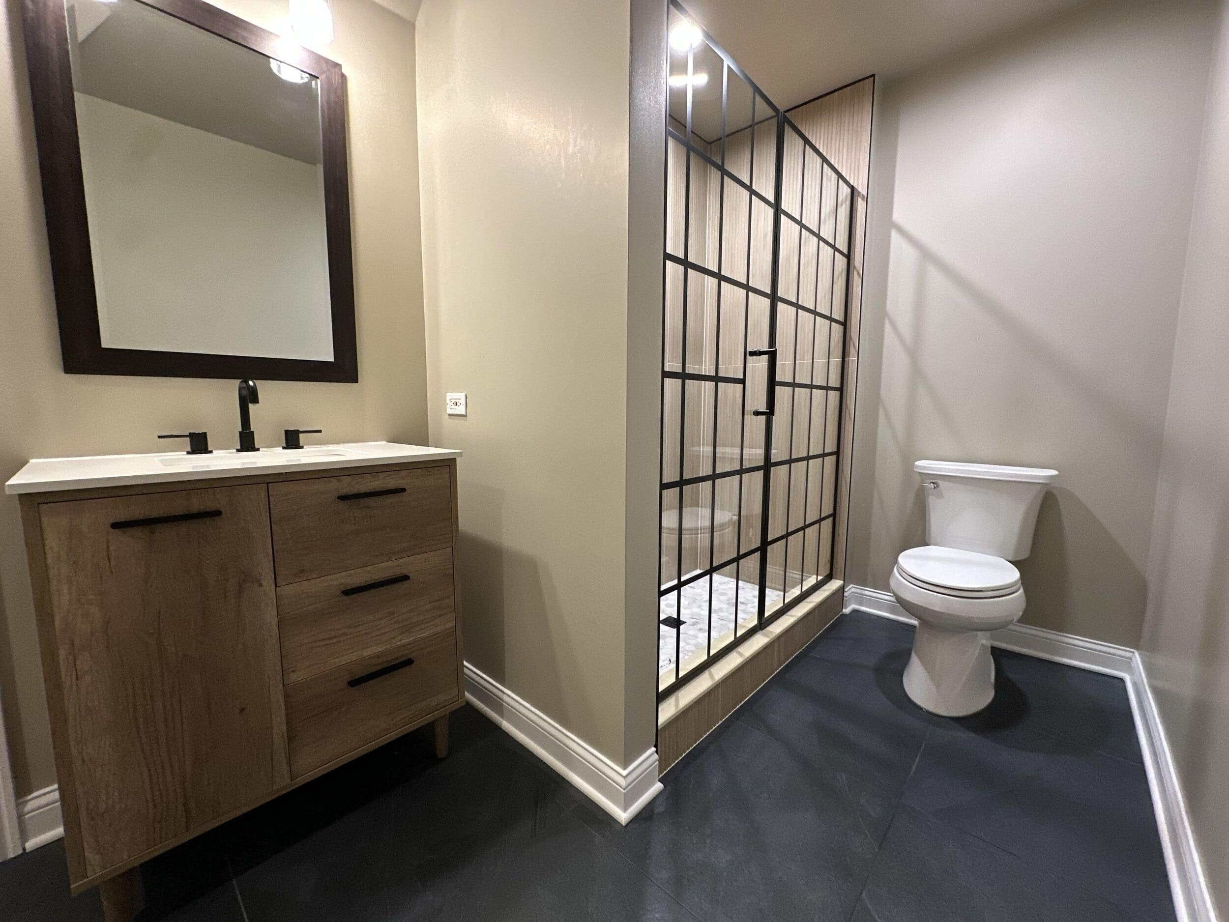 J&J bathroom remodel with black-framed shower