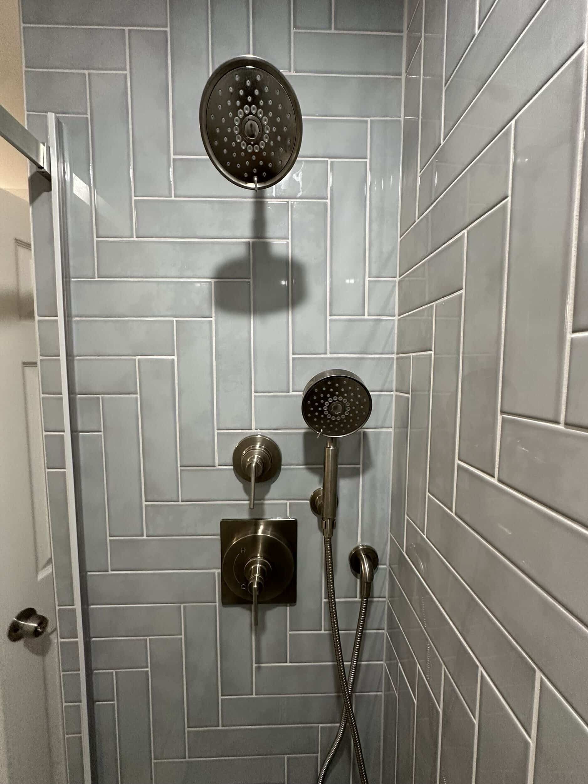 Bathroom tile installation with coordinated floor and wall surfaces